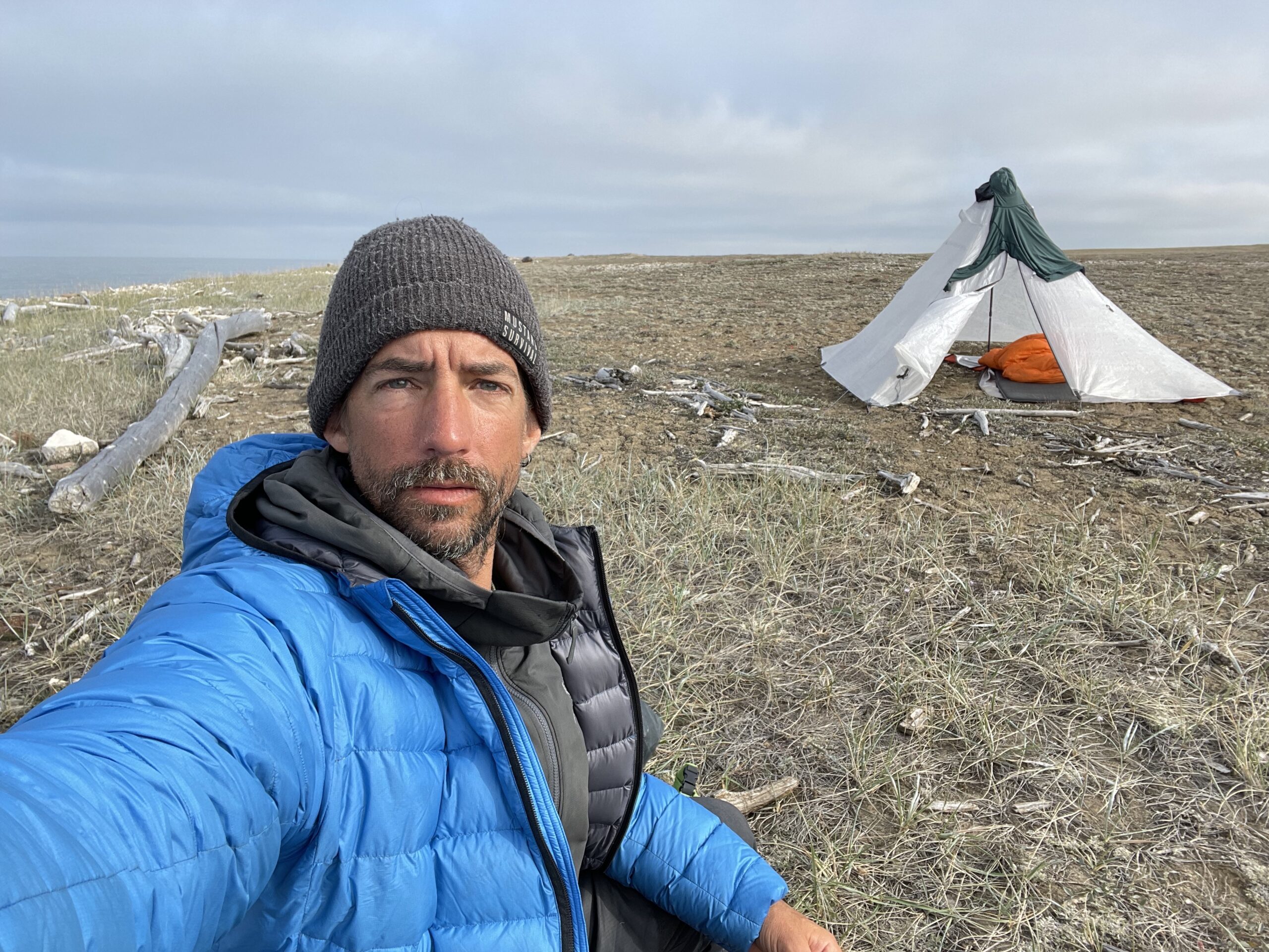 Karl Kruger in front of his tent